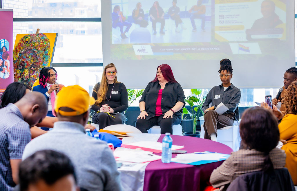 Panelists and participants engage in dialogue on shared power and leadership inclusion during the symposium.